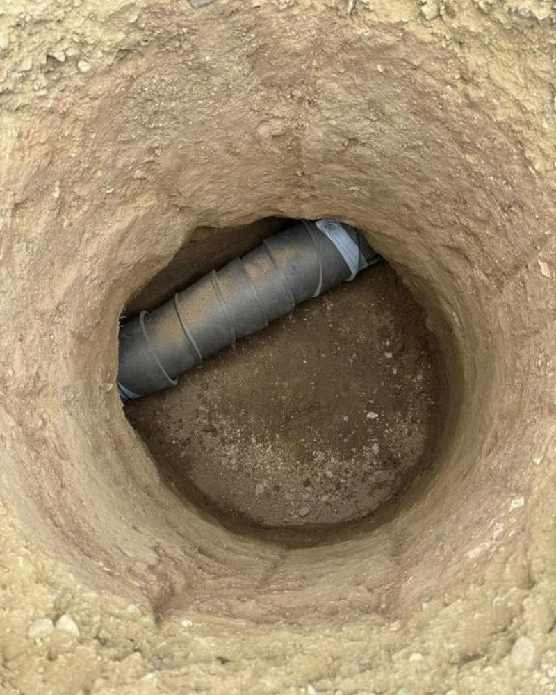 Pipe Exposed In A Dig — McLennan Plumbing & Gas